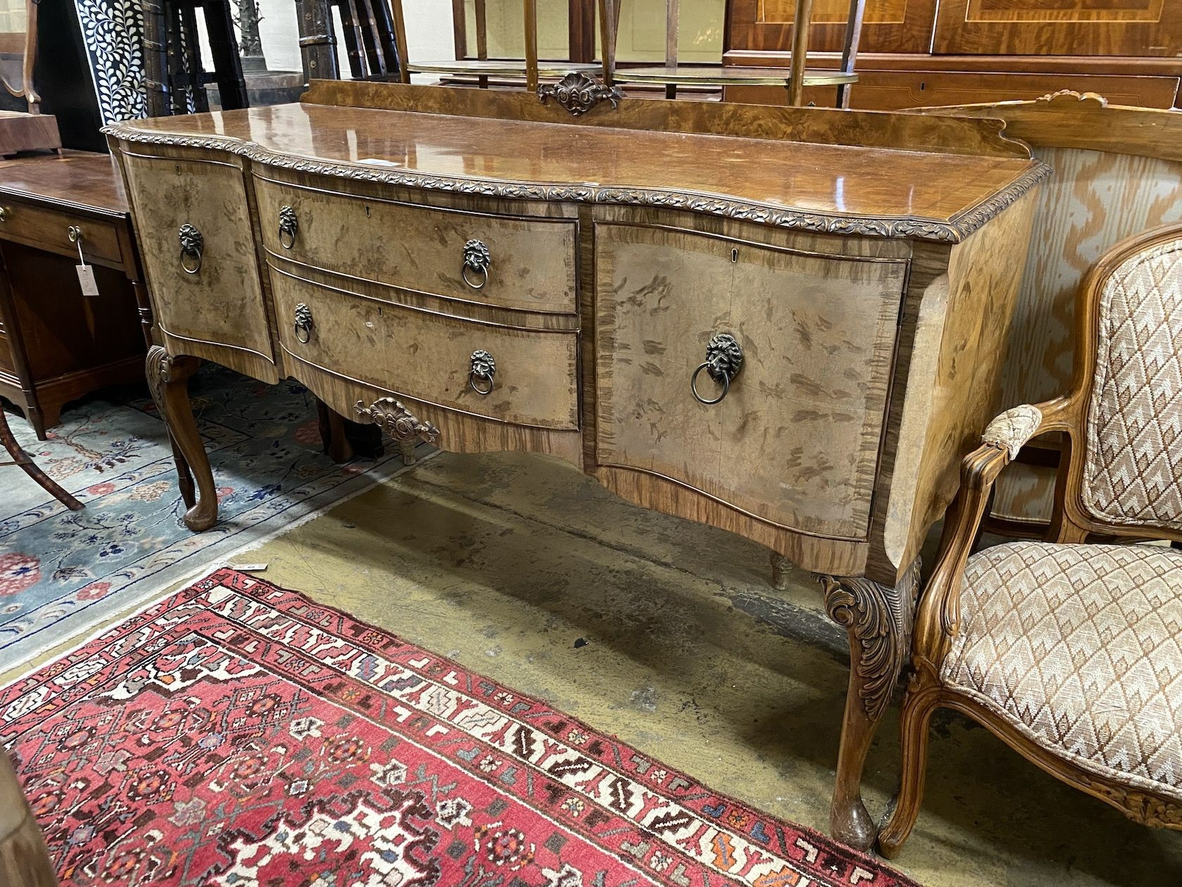 A Queen Anne revival banded walnut serpentine fronted sideboard, length 167cm, depth 56cm, height 99cm